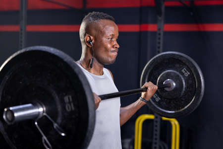 Black African American Man Holding Barbell Ready For Weight Lifting Workoutの写真素材