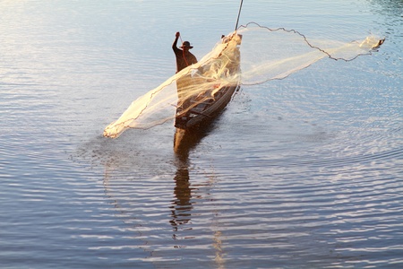 A fisherman working in the morningの写真素材