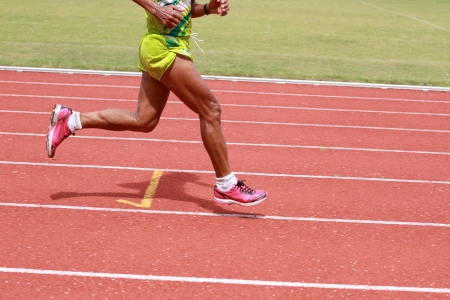 The old man is running on the running track の写真素材