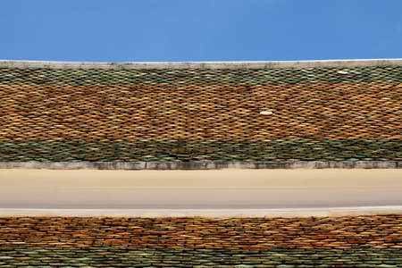 Roof tiles of Thai templeの写真素材