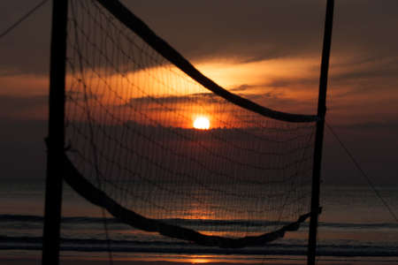 Sunset with beach volleyball net, Silhouette sunset, Selective focusの写真素材