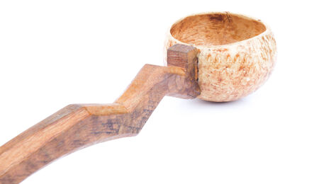 Dipper is made from a coconut shell with a wooden handle.の写真素材