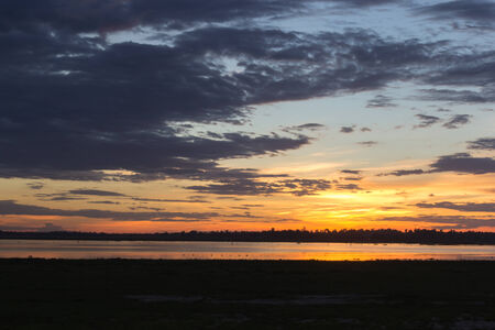Evening sunset over the lake in Thailand.の写真素材