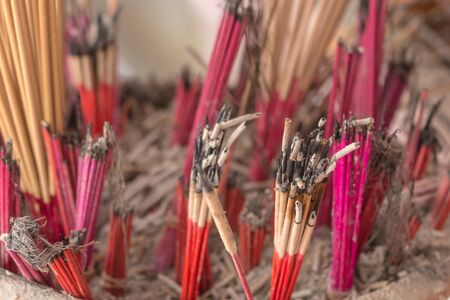 The flame of fire out of the fire, incense sticks.の写真素材
