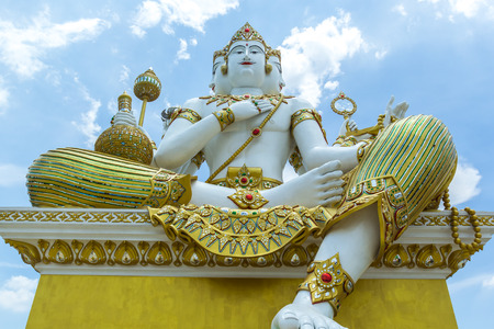 Brahma statue That looks white and decorated with beautiful ornaments. On the backdrop of the sky Is one of the main gods of the Hindu faith.の写真素材