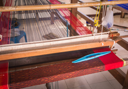 Loom made of plastic. The design of the home to put the thread used for weaving in Thailand.の写真素材
