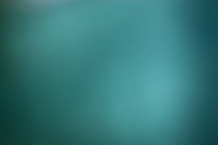 Green background, taken through a green filter in the light toward the sun, adjusting the image to be blurred.の写真素材