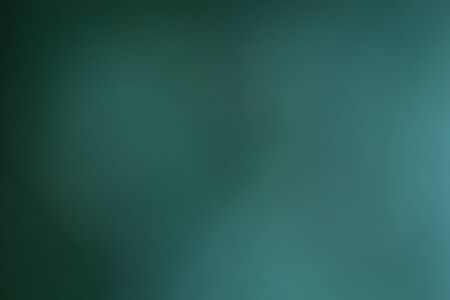 Green background, taken through a green filter in the light toward the sun, adjusting the image to be blurred.の写真素材