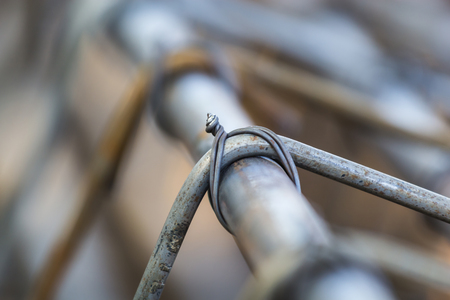 Closeup image of steel wire blurred both image and sharpened wire tie together.の写真素材