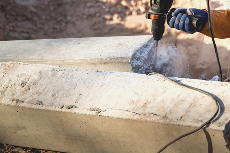Concrete mason Use a concrete drill bit. The concrete cracked.の写真素材