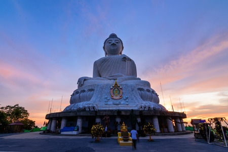 Big buddha in Phuket Thailand wiht sunset and color of skyの写真素材