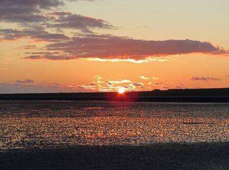 Sunset behind the dike of Ameland                              の写真素材
