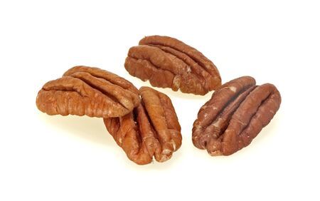 Group of pecans on a white background