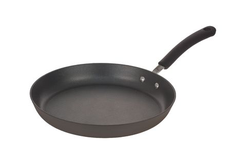 Black frying pan isolated on whiteの写真素材
