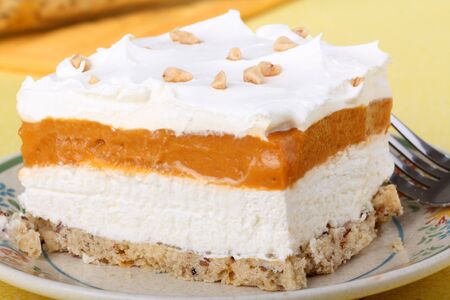 Butterscotch creamcheese topped with whipped cream dessertの写真素材