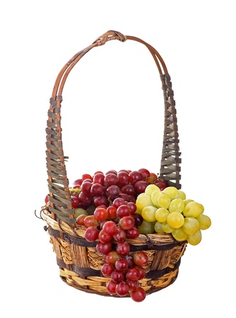 Red and green grapes in a basket isolated on whiteの写真素材