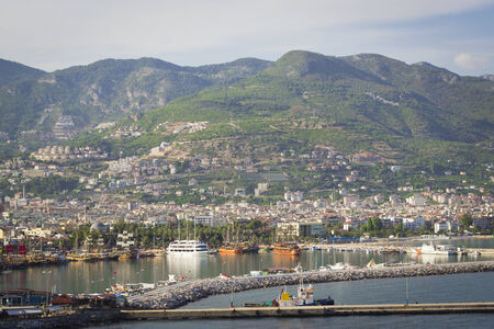 View from the fortress wall kizilkule the city, the sea, the harbour and the lighthouse in Alanyaの写真素材