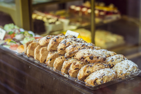 TALLINN, ESTONIA - YUNI 14, 2015: Delicious biscuits in a shop window on one of the Central streets,...