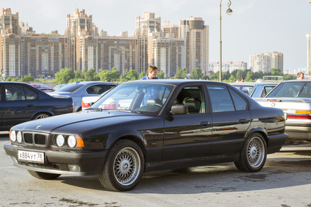 SAINT-PETERSBURG, RUSSIA - AUGUST 3, 2013: Old-car BMW 5-series e34 at the meeting, fans of the Bavarian automaker, Krestovsky island, St. Petersburgのeditorial素材
