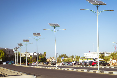 SHARM EL SHEIKH, EGYPT - FEBRUARY 20, 2014: Solar panels on electric pole for lighting on the road in the city, use of solar energy, Sharm El Sheikh, Egyptのeditorial素材