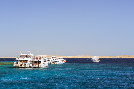 SHARM EL SHEIKH, EGYPT - FEBRUARY 25, 2014: Tourist boat trip around the Sinai on the white yacht, a luxury vacation for tourists in the Red sea, diving in coral reefs, Sharm El Sheikh, Egyptのeditorial素材