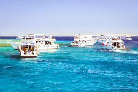 SHARM EL SHEIKH, EGYPT - FEBRUARY 25, 2014: Tourist boat trip around the Sinai on the white yacht, a luxury vacation for tourists in the Red sea, relax on the waves, Sharm El Sheikh, Egyptのeditorial素材