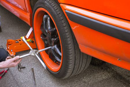 SAINT-PETERSBURG, RUSSIA - APRIL 5, 2014: Replacement car wheels on the road, St. Petersburg, Russiaのeditorial素材