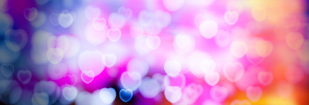 Valentine's Day Abstract blurred background with bokeh of hearts. The substrate for holiday greeting textの写真素材