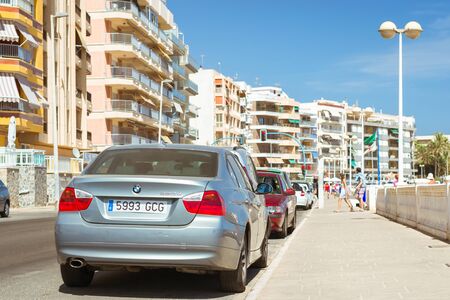 TORREVIEJA, SPAIN - SEPTEMBER 13, 2014: silver-metallic modern  car BMW 3-series 320d on sunny street, Av Doctor Mariano Ruiz Canovas, Torrevieja, Valencia, Spainのeditorial素材