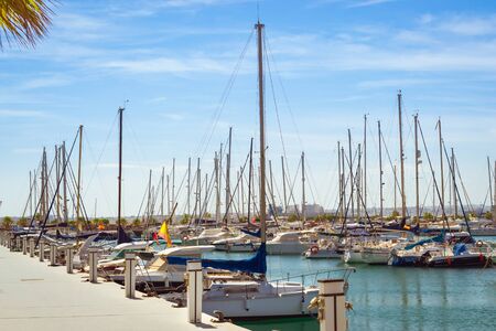 TORREVIEJA, SPAIN - SEPTEMBER 13, 2014: Puerto deportivo Marina Salinas. Yachts and boats parked at dock in Marina of Torrevieja. Bay with piers in centre of resort town. Valencia, Spainのeditorial素材