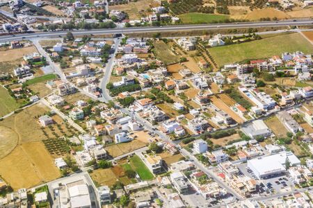 Aerial view of resort Crete island, flight altitude of aircraft. Mountainous landscape and roads-serpentines. Greeceの写真素材
