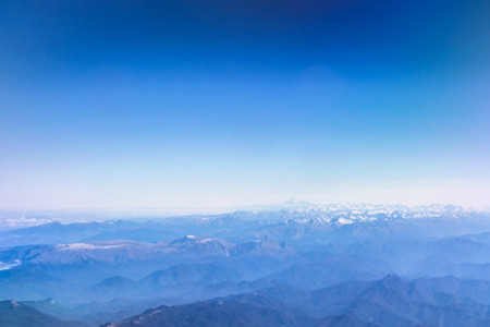 Airplane flying, cumulus clouds over Caucasus mountains. View of sky from aircraft, long distance travel by airtransport. Russian airlines, Krasnodar Kraiの写真素材
