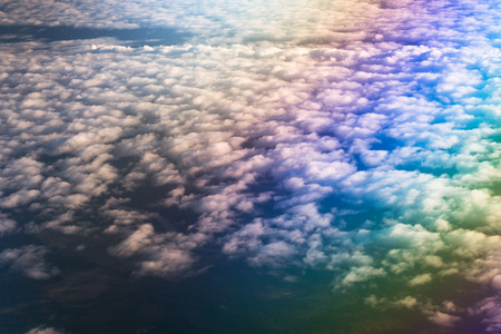 Airplane flying above cumulus clouds. View of sky from aircraft, long distance travel by airtransport. Russian airlinesの写真素材