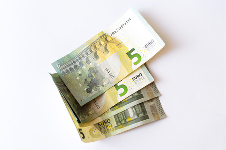 Euro banknotes are in denominations of 5 euros. Symbol of European currency to wealth and...