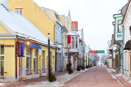 Parnu, Estonia - January 10, 2016: Architectural diversity in centre of resort Estonian town Parnu. Historic brick buildings and attractions. Snow-covered streets of tourist Baltic city in winterのeditorial素材