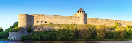Ivangorod fortress stand on banks of Narva river. Medieval fortifications on Estonian-Russian state border. Russiaの写真素材