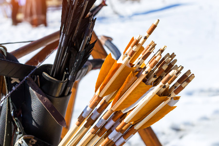 Arrows for archery and crossbow targets. Arrow handmade with natural feathers. National sports entertainment outdoors. Hit target as success of business and Affairs. Funny Nicholas Fortress, Russiaの写真素材