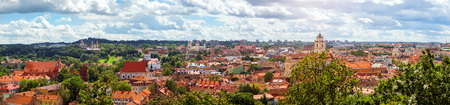 Panorama of Vilnius from top of mountain of Gediminas Tower. View of red rooftops of old town, spires and towers of cathedrals & churches. River Vilia parts of historic & business districts. Lithuaniaの写真素材