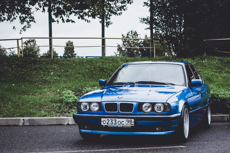 Saint-Petersburg, Russia - September 16, 2017: Blue retro car BMW 5-series 525, old model and release year. Road speed car of German Bavarian manufacturer BMW. Autumn meeting lovers of speed and driveのeditorial素材