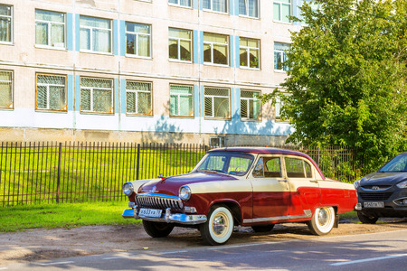 St.Petersburg, Russia - September 1, 2017: Soviet retro red car Volga GAZ-21 retro rally Gorky classic. Russian retro car stands on the side of the road in Krasnoe Seloのeditorial素材