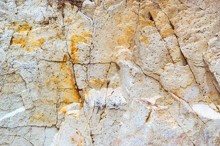 White stone texture. Rock formation with cracks and protrusions. Mountain of castle San Juan. Spanish beach resort Blanes in summertime, Costa Brava, Catalonia, Spainの写真素材
