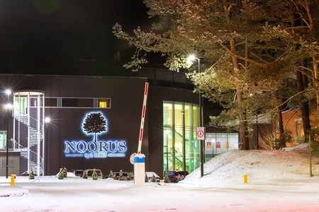 Narva-Joesuu, Estonia - 17, January 2017: Modern building Noorus SPA Hotel made of glass and concrete amidst a snowy winter landscape at night. Narva-Joesuu resort town in Estonia in Ida-Virumaaのeditorial素材