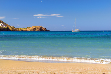 Boat trips on a white sailing yacht. View from sunny Livadi beach in resort village Bali. Rethymno, Crete, Greece. Extreme water sports as active recreation on sunny vacationsの写真素材