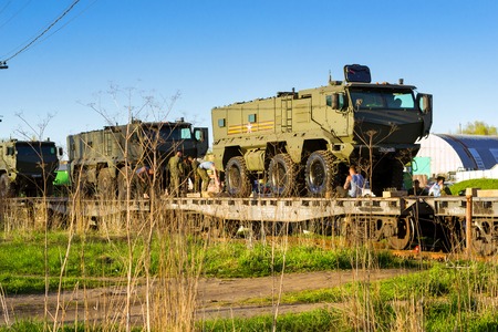 St.Petersburg, Russia - may 10, 2018: Modern Russian military armored car Typhoon-K, installed on transport railway platform for transportation to place of military exercises. Army equipment, weaponsのeditorial素材