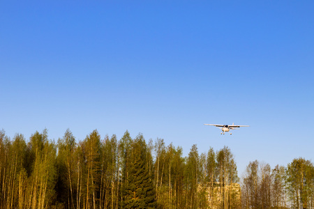 Light passenger plane lands at a private airport, Kronshtadt, St. Petersburg, Russia. Professional...
