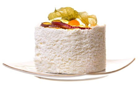 A piece of cake with fruits and foam, isolated on white background.の写真素材