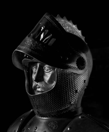 The head of metal knight on black background の写真素材