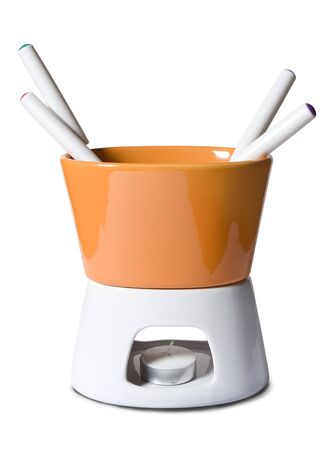 Isolated fondue set for cooking melted cheese or chocolate meal の写真素材
