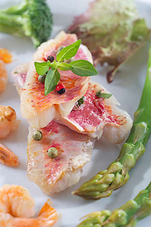 Red mullet fillets with garnishの写真素材