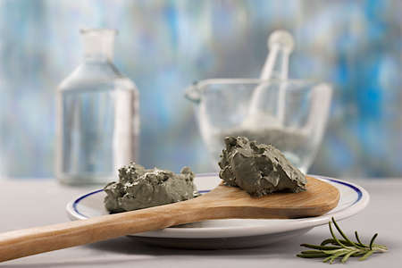 Composition with cosmetic clay for spa treatments, in wooden spoonの写真素材
